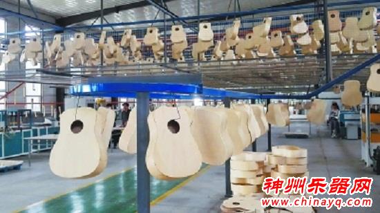 武强打造世界最大乐器产业基地 一分钟生产一把吉他